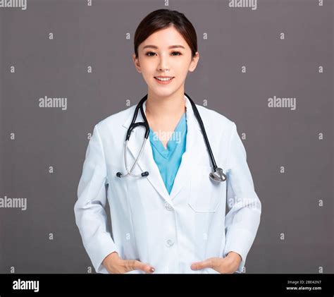 white coat psychological clinic photos|Portrait of young smiling asian female doctor in white coat .